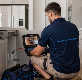 Clearing a blocked sink at a Cammeray property